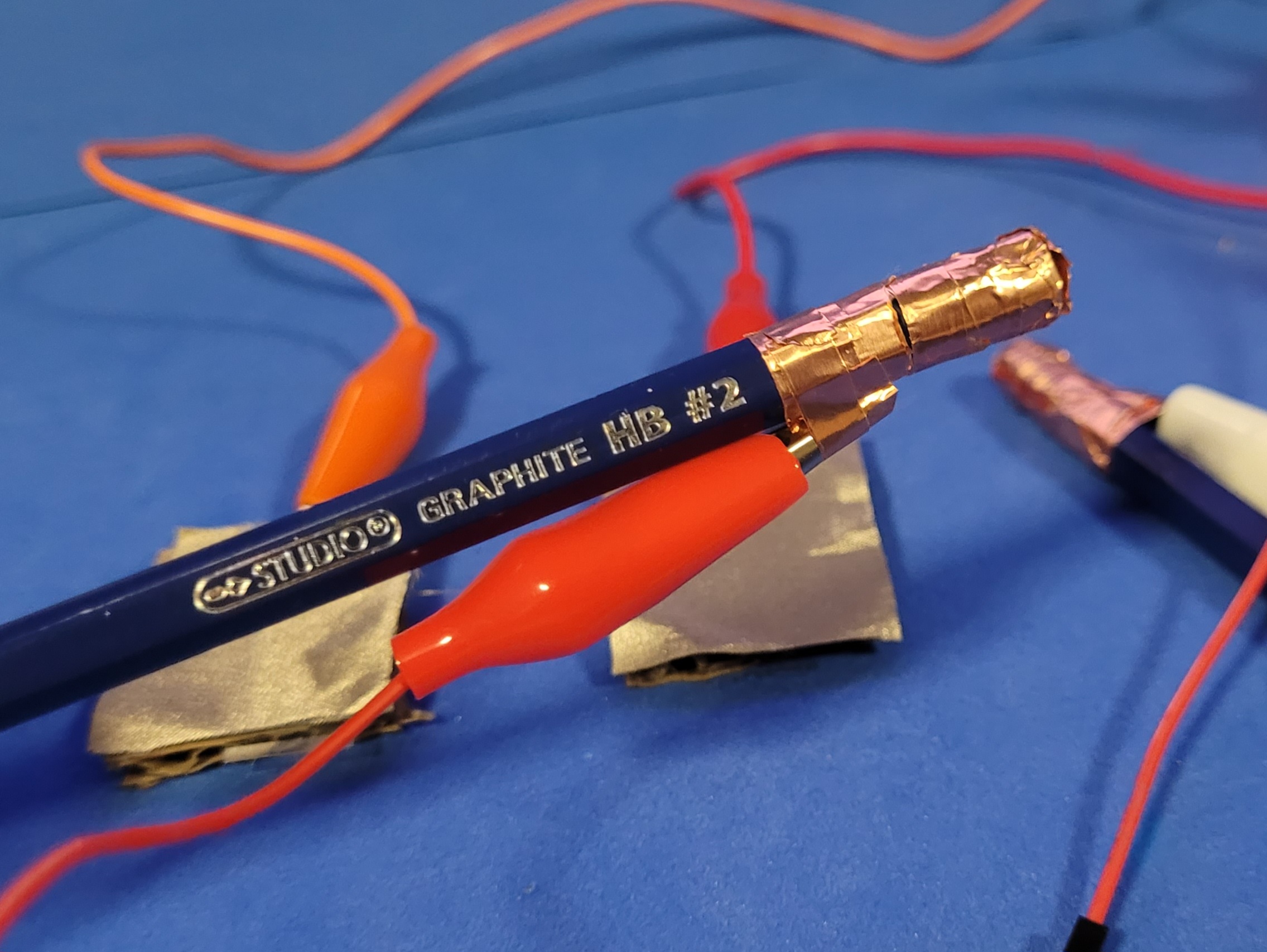 A closeup photo of one of the pencils that act as the drumsticks that are grounds to the makeymakey